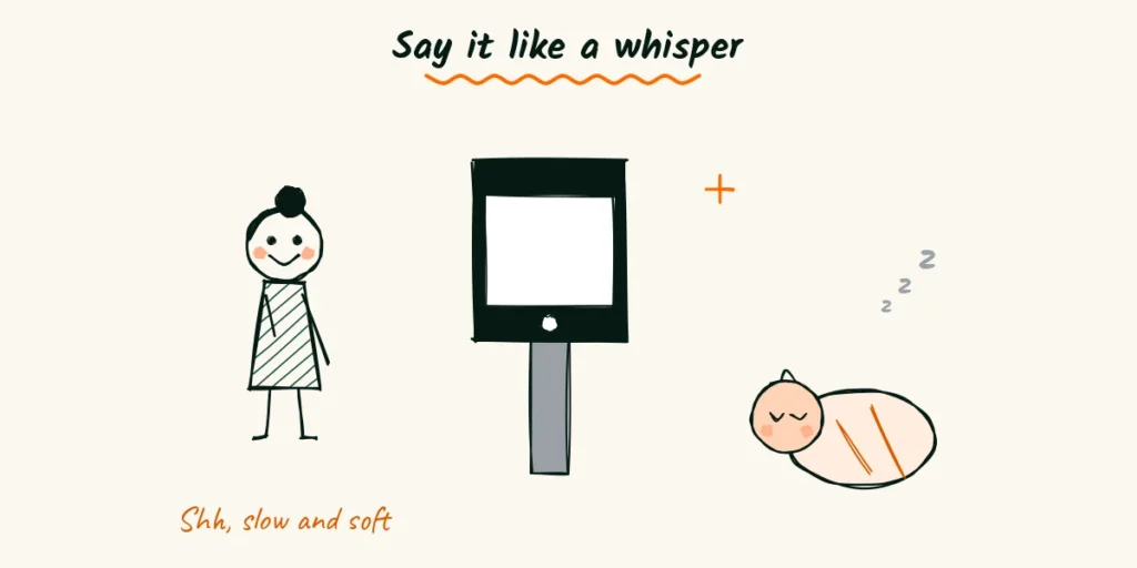 Say it like a whisper A doodle photographer speaking softly into a phone on a small stand beside a sleeping newborn