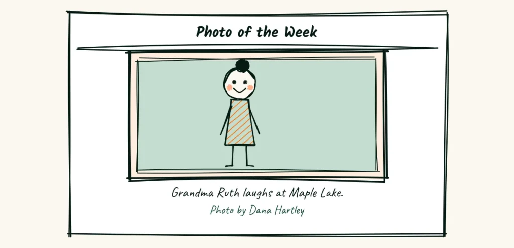 A strong photo with a clear caption A photo page with a large framed portrait of a laughing woman, a short caption and a photo credit line